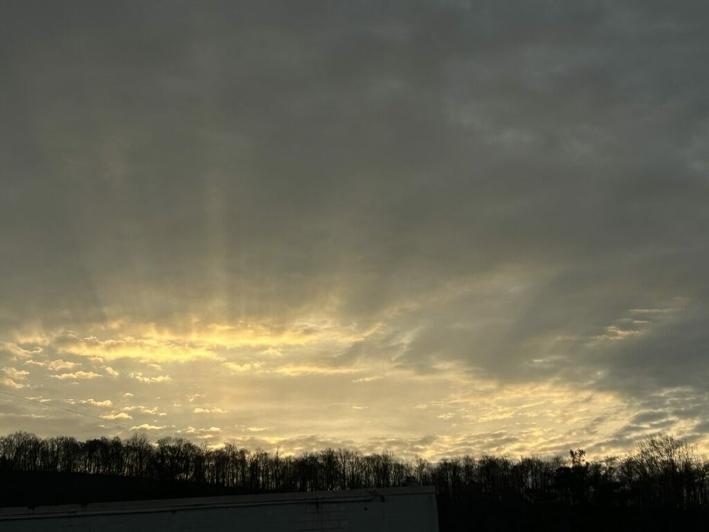 Photo of sun breaking through clouds