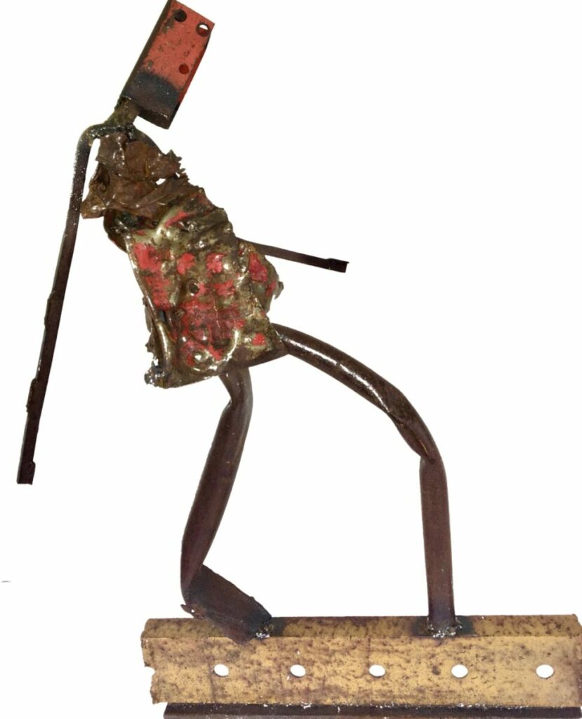 Sculpture of humanoid figure with mask