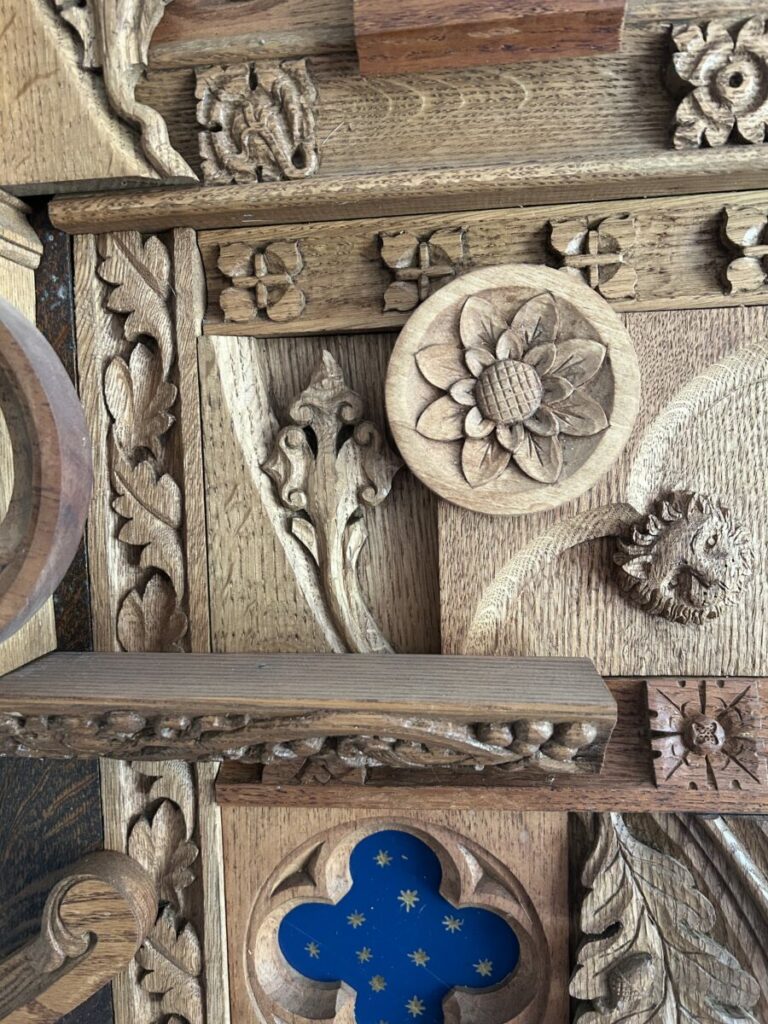 Photo of a piece of wood inlaid with floral designs