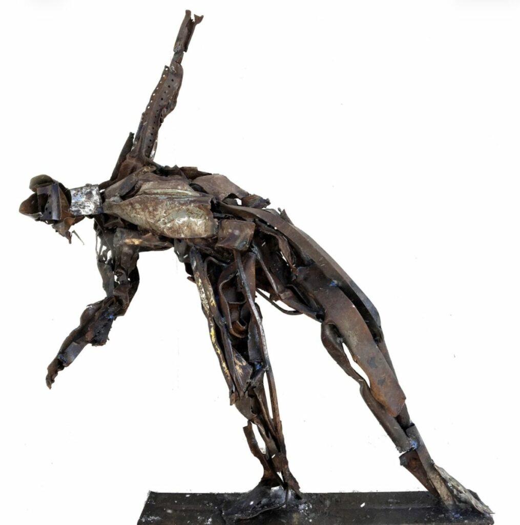 Sculpture of person leaning heavily to side