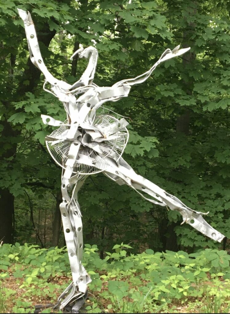 Sculpture of metallic ballerina figure