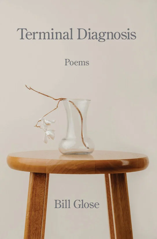 book cover that says terminal diagnosis, brown table with clear vase
