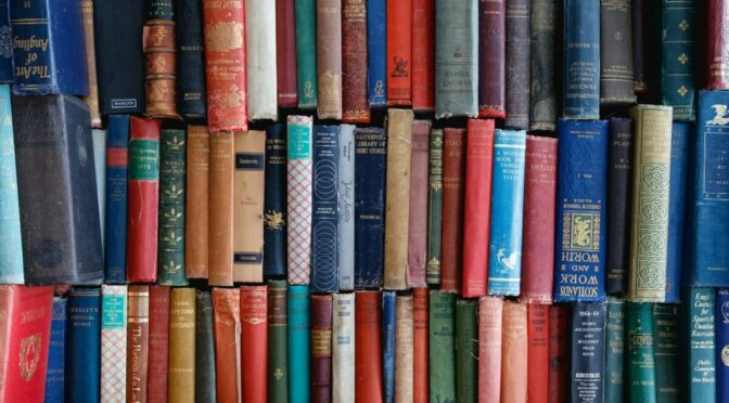 Photo of many books piled on top of each other